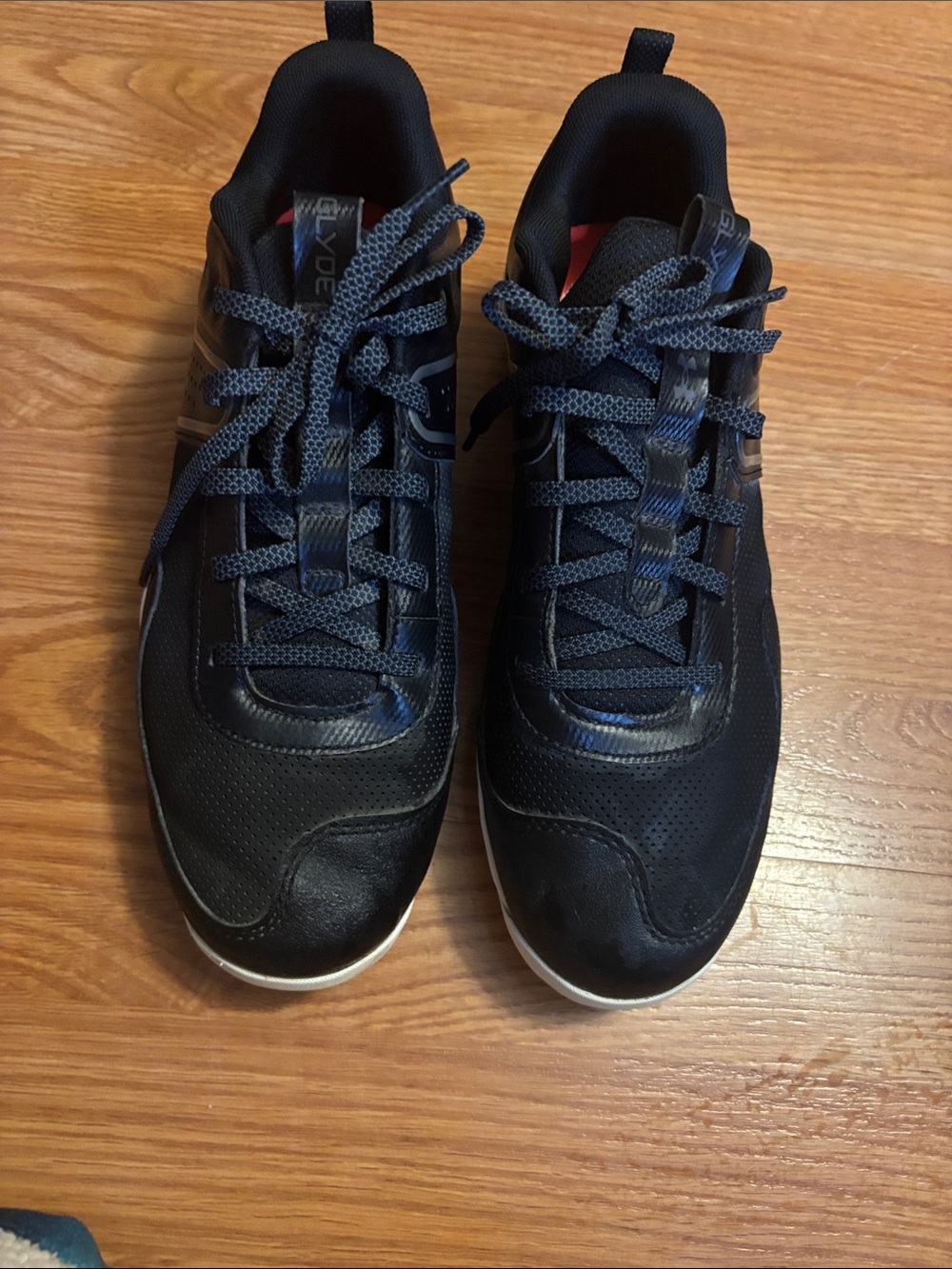 Under Armour, riven  sisterhood, cleats, size 10 black in color